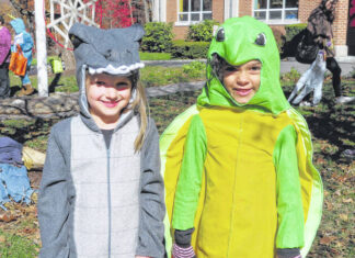 Halloween fun at the library Melody Fedor, left, and Julie Harris checking out the Halloween activities at the library.