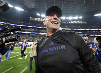 							                                Washington coach Kalen DeBoer smiles after the teams victory over Oregon in the Pac-12 championship NCAA college game earlier this year in Las Vegas. DeBoer has made a rapid rise through the coaching ranks. He won three NAIA national championships as head coach at the University of Sioux Falls from 2005-09 and had five coaching stops in 12 years before landing at Washington.                                 AP photo					