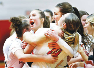 							                                Crestwood players (from left) Jordan Andrews Kate Gallagher and Charlie Hiller enbrace in celebration of their win in the opening round of the PIAA Class 5A state playoffs against Manheim Central.                                 Fred Adams | For Times Leader					