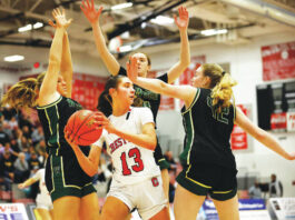 							                                Crestwood’s Jackie Gallagher looks to pass late in the fourth quarter while being swarmed by Archbishop Wood defenders. The Comets fell to the Vikings in Saturday’s PIAA Class 5A semifinals at Parkland High School.                                 Fred Adams | For Times Leader					