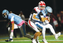 							                                Dallas cornerback Tyce Mason intercepts a pass in the end zone meant for Crestwood wide receiver Jack Rodgers to end the first half.                                 Fred Adams | For Times Leader					