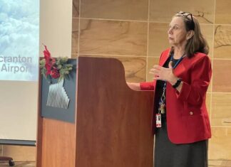 							                                Wilkes-Barre/Scranton International Airport Acting Executive Director BJ Teichman reports at Thursdays meeting of the Bi-County Airport Board.                                 Bill O’Boyle | Times Leader					