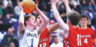 							                                Dallas point guard Joey Nocito takes aim at the basket as Crestwoods Jack Rodgers (12) and Zach Sechleer defend in the first quarter.                                 Fred Adams l For Times Leader					