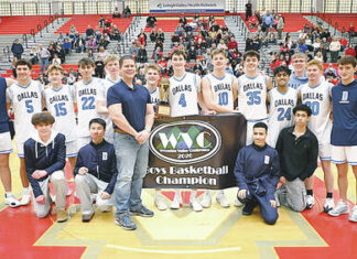 							                                Dallas displays the WVC championship banner and trophy after defeating Crestwood 43-38 on Saturday. It was the Mountaineers third straight season winning the tournament.                                 Tony Callaio | For Times Leader					