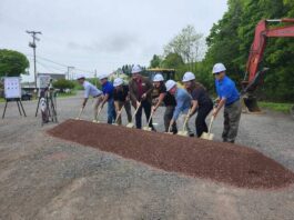 							                                Wearing hard hats, some of the people who helped bring about the construction of a new 4.7-mile section of the Delaware & Lehigh Trail dig with ceremonial shovels. The new section of trail should be completed by the end of summer and connect Mountain Top with the Oliver Mills.                                 Mary Therese Biebel | Times Leader					
